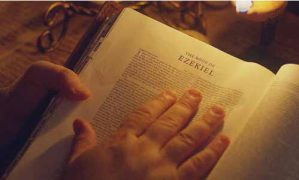 Hand in Bible